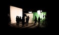 Silhouette images of video production behind the scenes Royalty Free Stock Photo