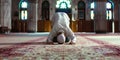 Silhouette of Indonesian Muslim man praying in the mosque