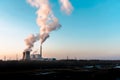 Silhouette of industrial factory smoke stack of coal power plant from chimney up on sky cause air pollution and destroy the Earth Royalty Free Stock Photo