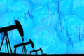 Silhouette industrial oil pump jack and falling oil graph on the blue globe background