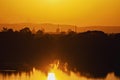 Silhouette,Industrial plant is located on the river,