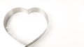 the silhouette of the iron heart on a white background is isolated. a baking dish means love Royalty Free Stock Photo