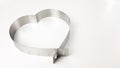 the silhouette of the iron heart on a white background is isolated. a baking dish means love Royalty Free Stock Photo