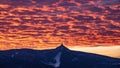 Silhouette of Jested mountain at sunset time with beautyifully illuminated evening sky, Liberec, Czech Republic