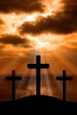 Silhouette of Jesus Christ crucifixion on cross on Good Friday Easter over heaven sunrise -Three Crosses On Hill vertical Royalty Free Stock Photo