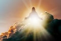 Silhouette of Jesus Christ in Heaven, up in the clouds against a bright ethereal light. Christian concept of salvation Royalty Free Stock Photo