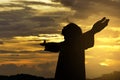 Silhouette of Jesus christ standing with raised arms Royalty Free Stock Photo