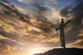 Silhouette of Jesus with Cross over sunset concept for religion, worship, Christmas, Easter, Redeemer Thanksgiving prayer and Royalty Free Stock Photo