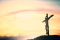 Silhouette of Jesus with Cross over sunset concept for religion, worship, Christmas, Easter, Redeemer Thanksgiving prayer and Royalty Free Stock Photo