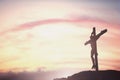 Silhouette of Jesus with Cross over sunset concept for religion, worship, Christmas, Easter, Redeemer Thanksgiving prayer and Royalty Free Stock Photo