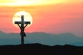 Silhouette Jesus and the cross over sunset on mountain with copy space (Painting draw water color) Royalty Free Stock Photo