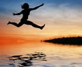 Silhouette jump girl on water Royalty Free Stock Photo