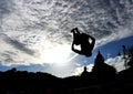 Silhouette of jumping guy on the beach San Terenzo, Lerici, Liguria, Italy