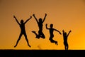 Silhouette of jumping kids against sunset Royalty Free Stock Photo