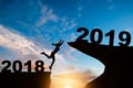 Silhouette of a jumping woman on the hill 2019 years while celeb