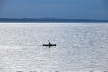 silhouette of a kayak on a large lake Royalty Free Stock Photo