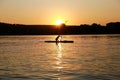 Silhouette of kayaking man at sunset Royalty Free Stock Photo