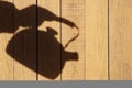 Silhouette with Kettle on the Natural Wooden Panel