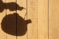 Silhouette with Kettle on the Natural Wooden Panel