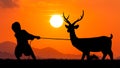 Silhouette of kid boy play with Reindeer