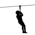 Silhouette of a kid playing with a tyrolean traverse Royalty Free Stock Photo
