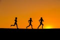 Silhouette of kids running against sunset Royalty Free Stock Photo