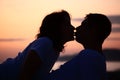 Silhouette kissing man and woman on beach Royalty Free Stock Photo