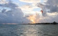 Silhouette of a Kite surfer in the ocean at sunset Royalty Free Stock Photo