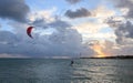 Silhouette of a Kite surfer in the ocean at sunset Royalty Free Stock Photo
