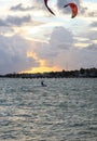 Silhouette of a Kite surfer in the ocean at sunset Royalty Free Stock Photo