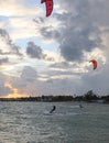 Silhouette of a Kite surfer in the ocean at sunset Royalty Free Stock Photo