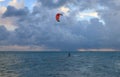 Silhouette of a Kite surfer in the ocean at sunset Royalty Free Stock Photo