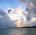 Silhouette of a Kite surfer in the ocean at sunset Royalty Free Stock Photo