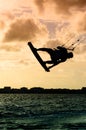 Silhouette of a kitesurfer flying Royalty Free Stock Photo