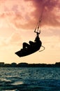 Silhouette of a kitesurfer flying Royalty Free Stock Photo