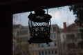 Silhouette of a lamp hanging from the ceiling against a window Royalty Free Stock Photo
