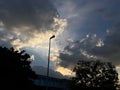 Lamp post golden clouds blue sky. Royalty Free Stock Photo