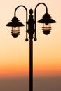 Silhouette lamp on sunset