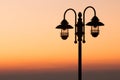 Silhouette lamp on sunset