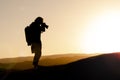 Silhouette Landscape Photographer at Sunset