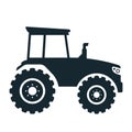 Silhouette of a large agricultural tractor on a white background.