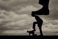 Silhouette of a large leg presses on a man who also presses his foot on another man lying on the ground Royalty Free Stock Photo