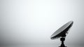 Silhouette of a large satellite dish against a plain, light background Royalty Free Stock Photo
