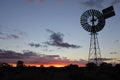 Silhouette of a large windmill in central Australia outback Royalty Free Stock Photo