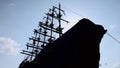 The silhouette of a large wooden ship with mast and sail against the sky Royalty Free Stock Photo