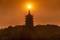 Silhouette Leifeng Pagoda is a five stories tall tower with eight sides, located on Sunset Hill south of the West Lake in Hangzhou Royalty Free Stock Photo