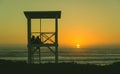 Couple lifeguard tower beach sunset Royalty Free Stock Photo