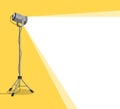 Silhouette of light lamp projector on tripod with scattered rays. Projecting a beam of spotlight is glowing on down. Cinema Royalty Free Stock Photo
