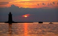 Silhouette Of The Lighthouse And Boats During The Sunset At Cape Henlopen State Park, Lewes, Delaware, U.S.A