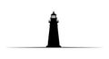 A silhouette of a lighthouse stands Royalty Free Stock Photo